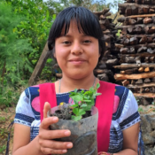 Raquel holding a plant